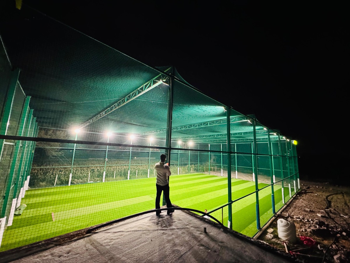 Player standing outside the cage