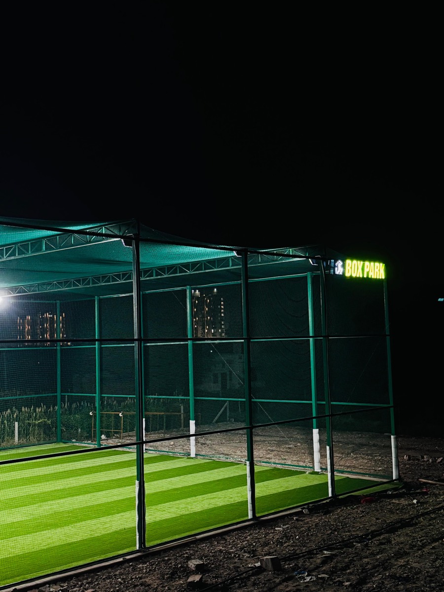 Caged turf under floodlights