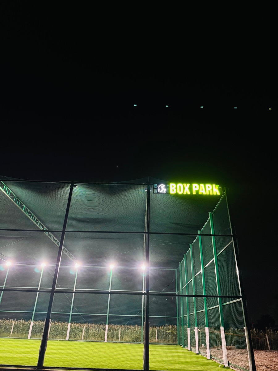 BOXPARK signage glowing at night