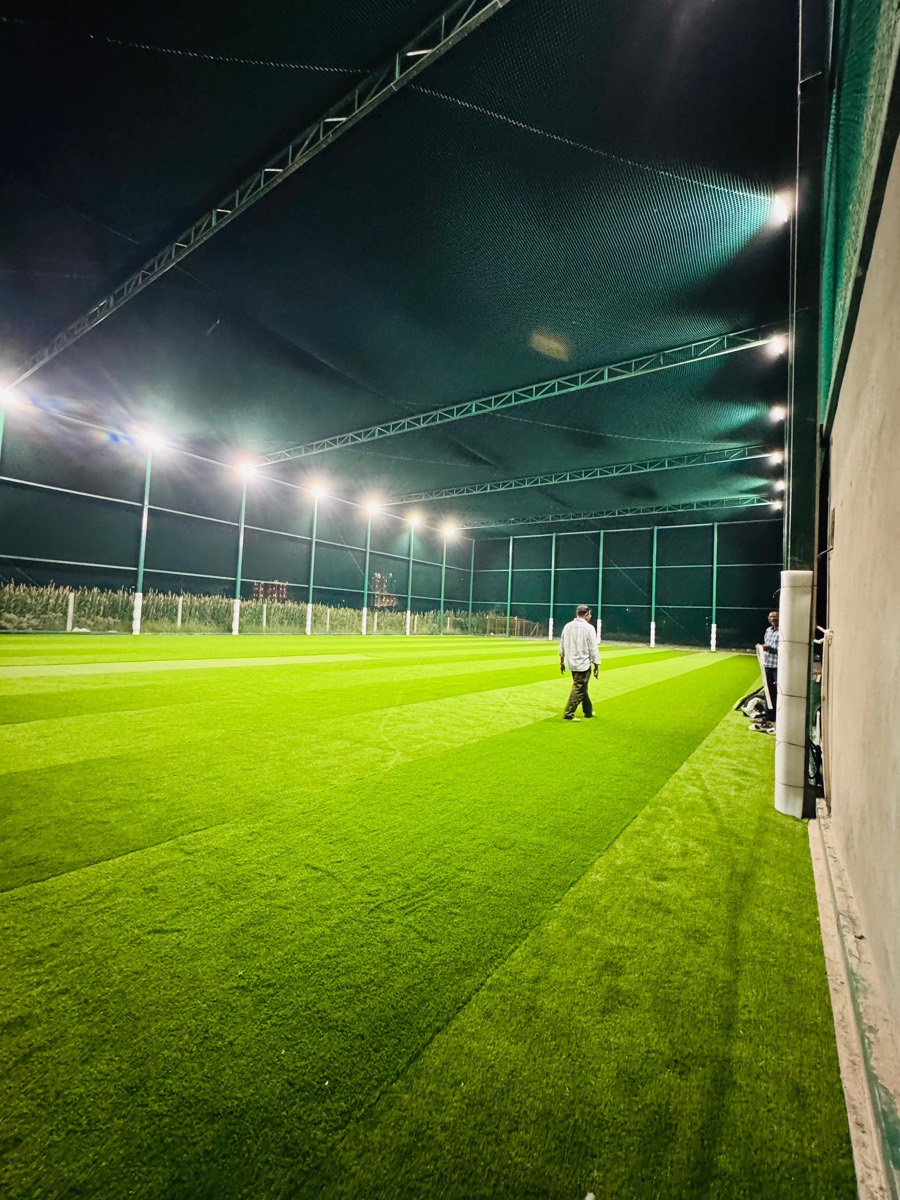 Wide view of the floodlit turf