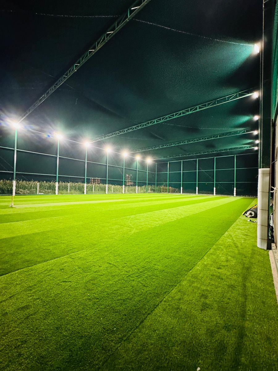 Inside the caged turf arena